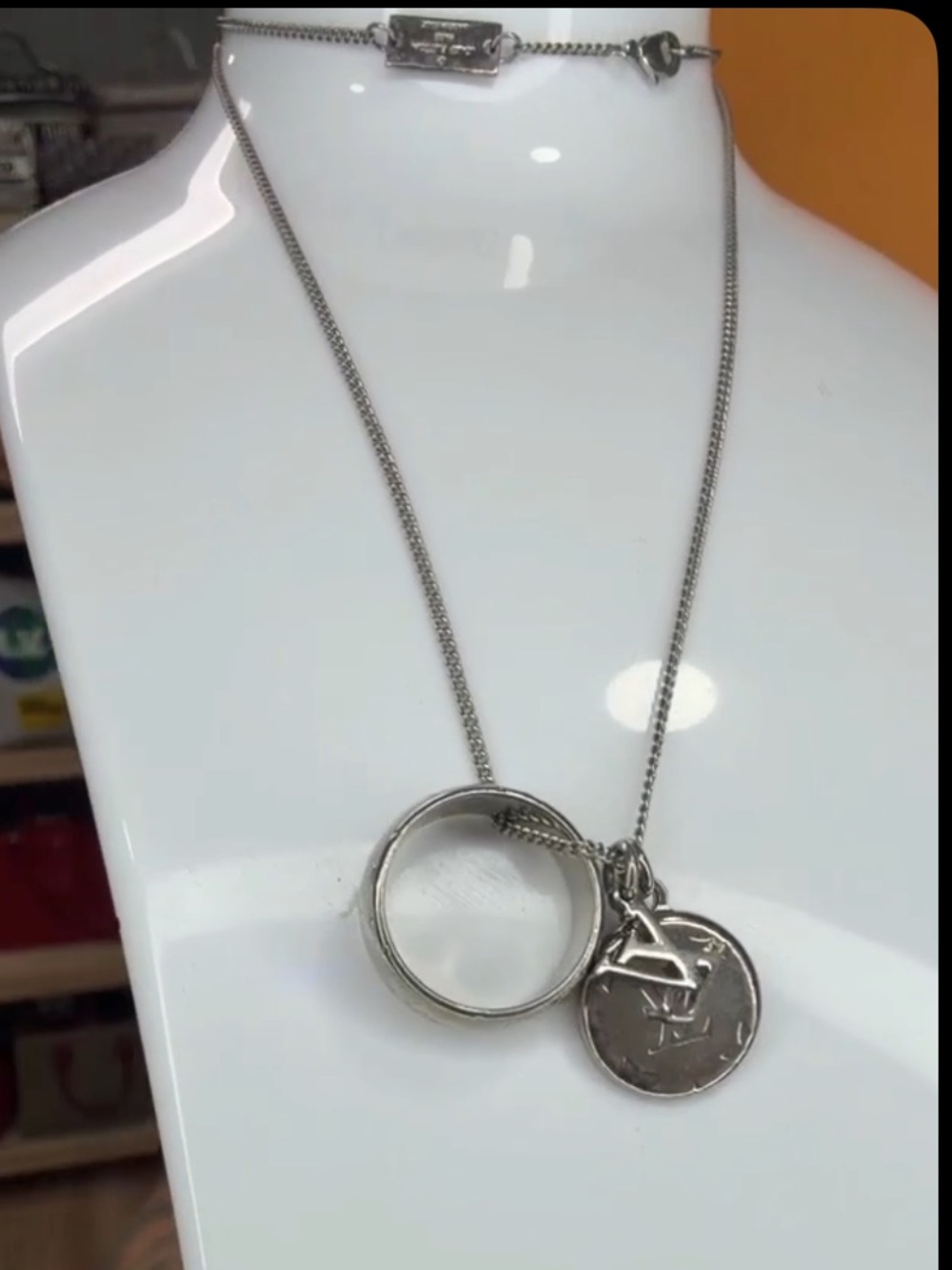 Louis Vuitton LV Silver Monogram
Disc and LV Pendant & Charm Necklace - EUC